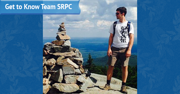 Senior Transportation Planner Colin Lentz poses at the top of a mountain for his submitted photo for his "Get to Know Team SRPC" blog feature