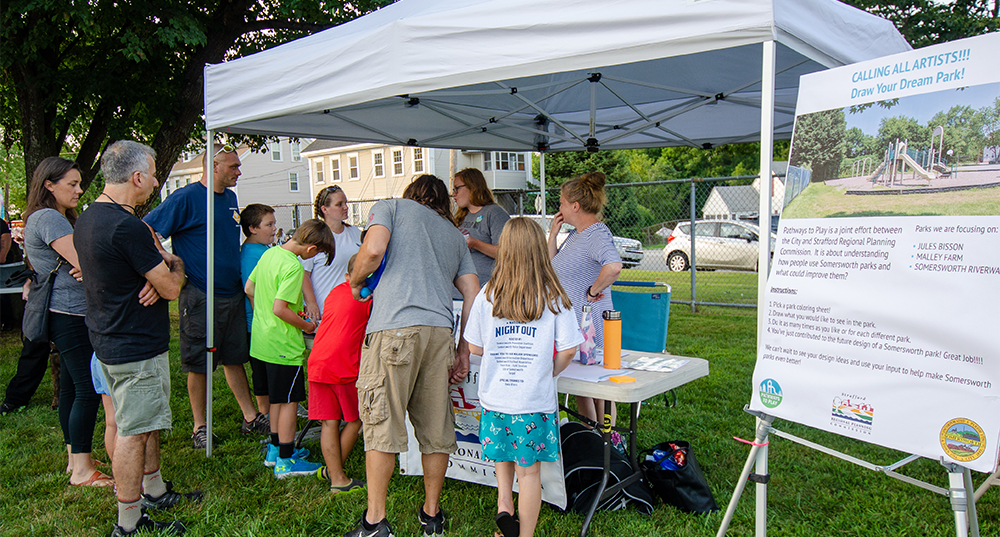 Citizens engage with SRPC staff on the Pathways to Play project at national night out in Somersworth