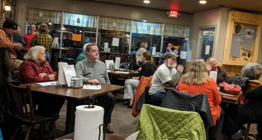 Crowd gathers at a Rochester restaurant for a lead poisoning safety outreach event.