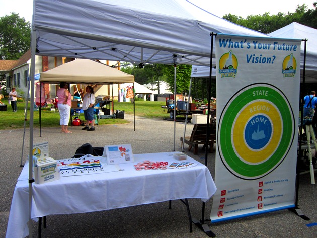 Interactive outreach display setup at a booth at the Middleton Yard Sale
