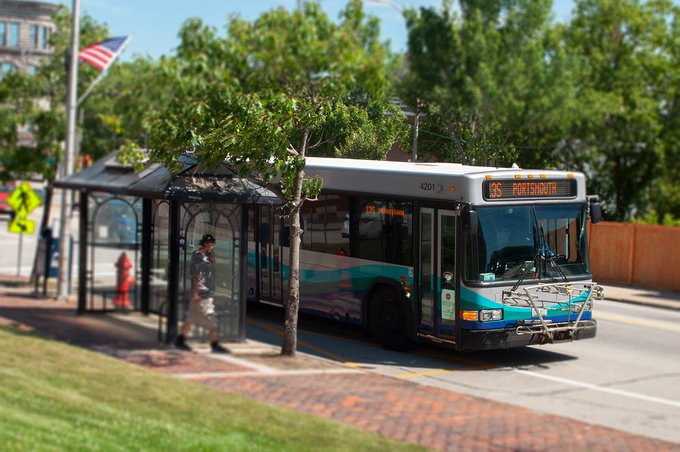 A COAST Bus stopping at a bus stop
